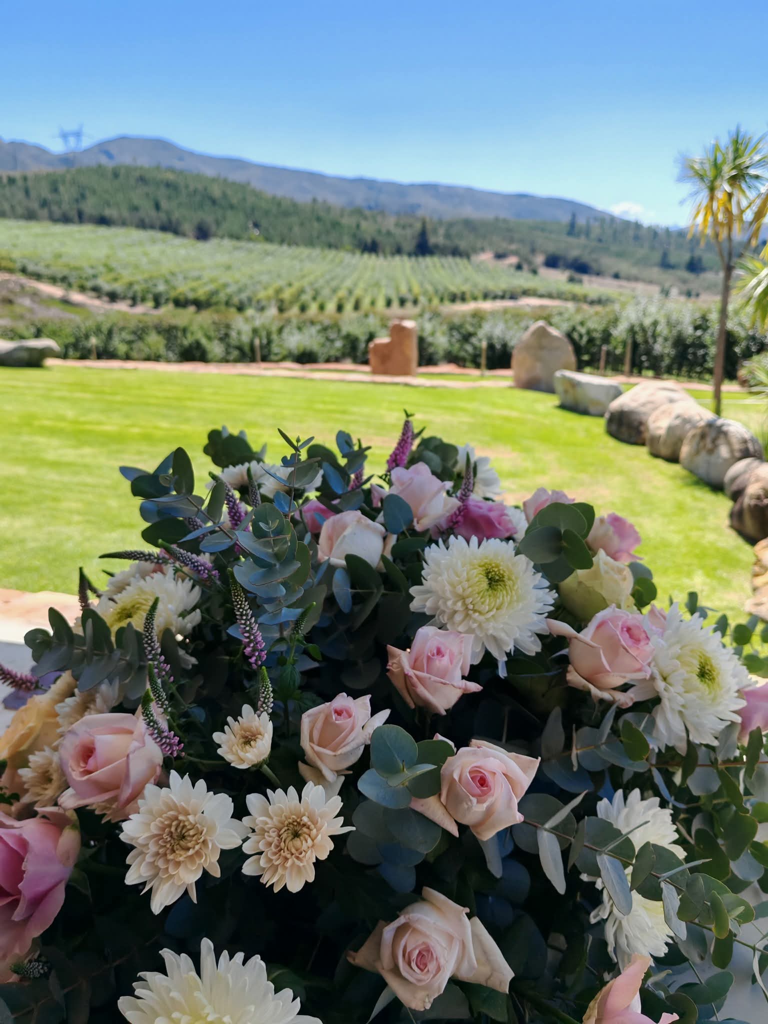 Flower arrangement overlooking a scenic venue view