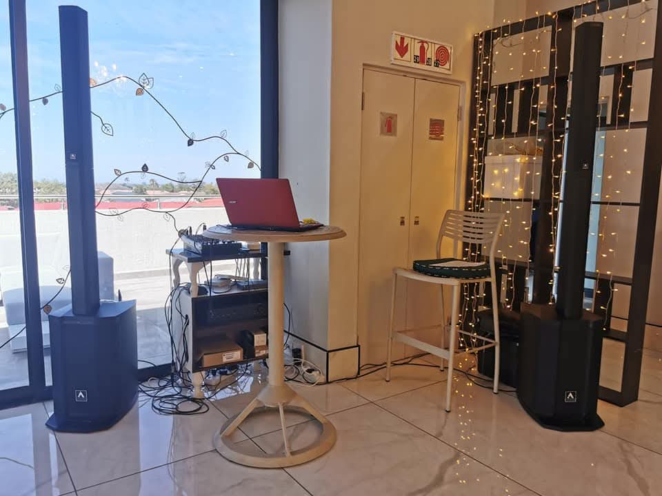 Murphy sound system beside a decorated indoor event wall