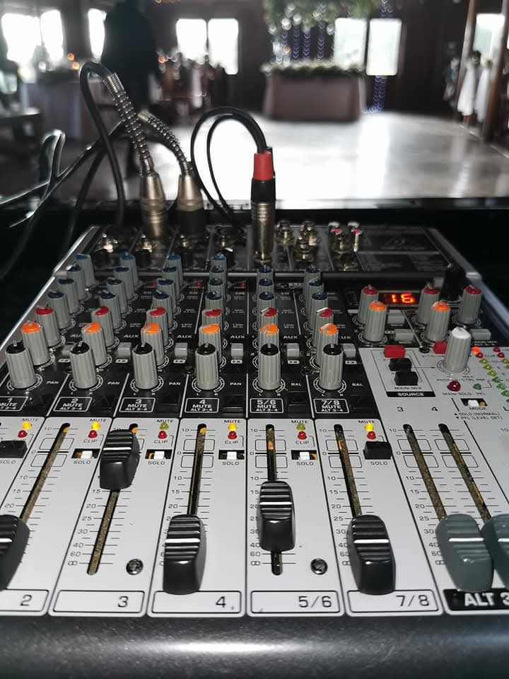 Close-up of sound mixer controls at a live event
