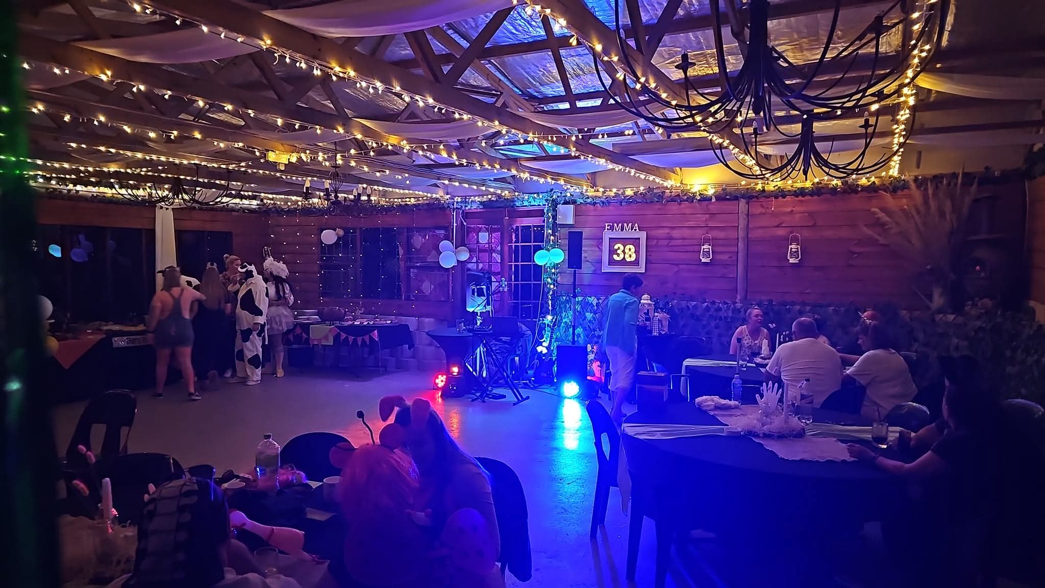 Decorated event room with lighting and sound support