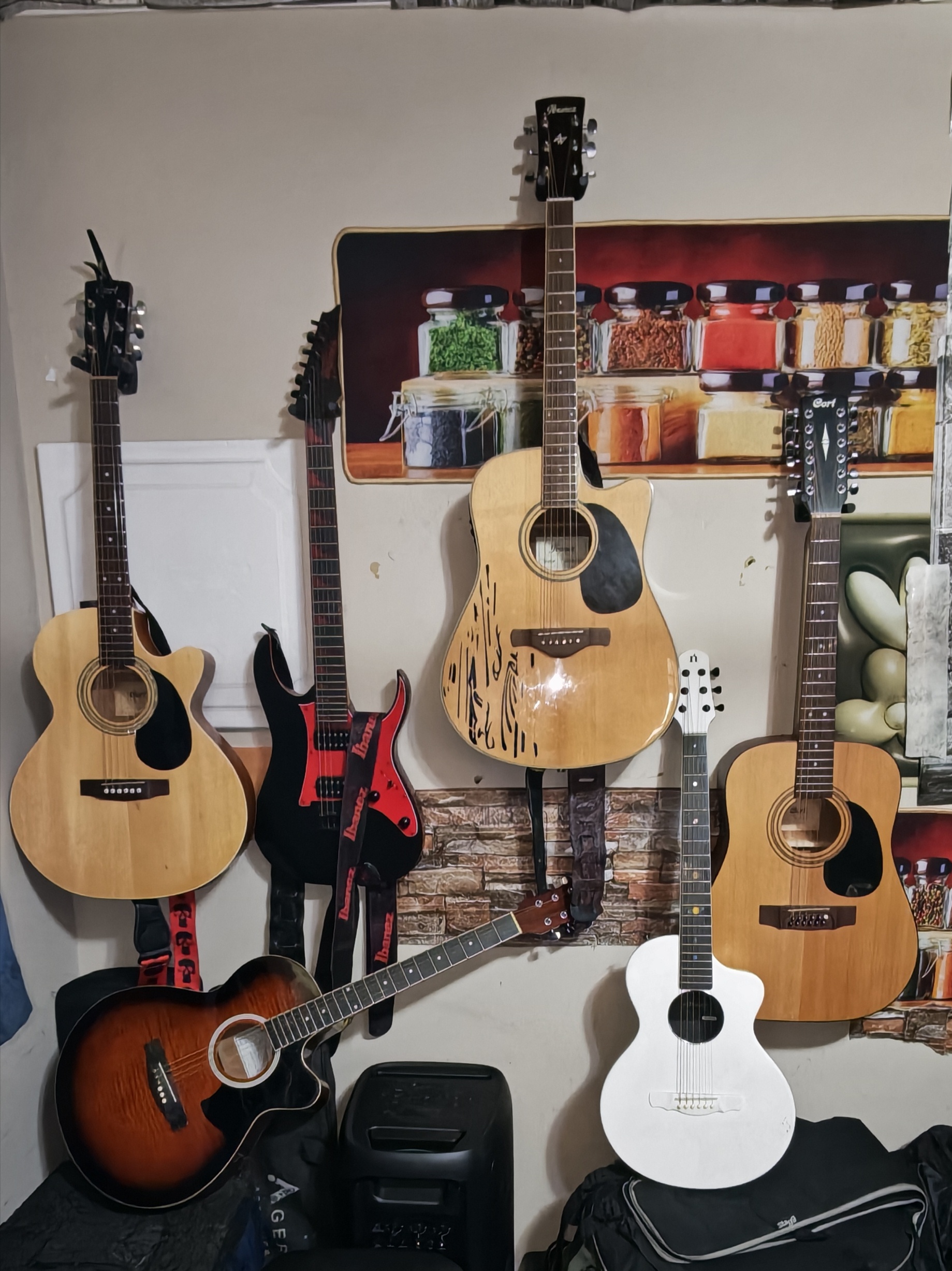 Collection of acoustic and electric guitars on display
