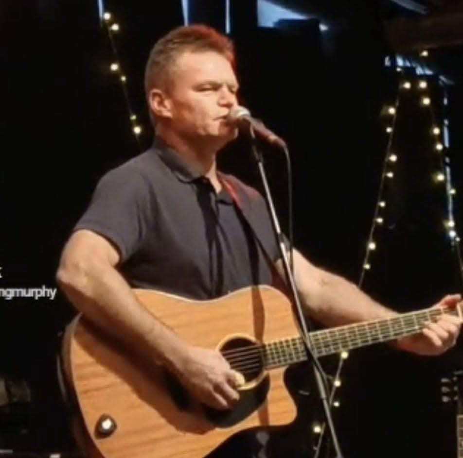 Edward Murphy performing live on guitar and vocals